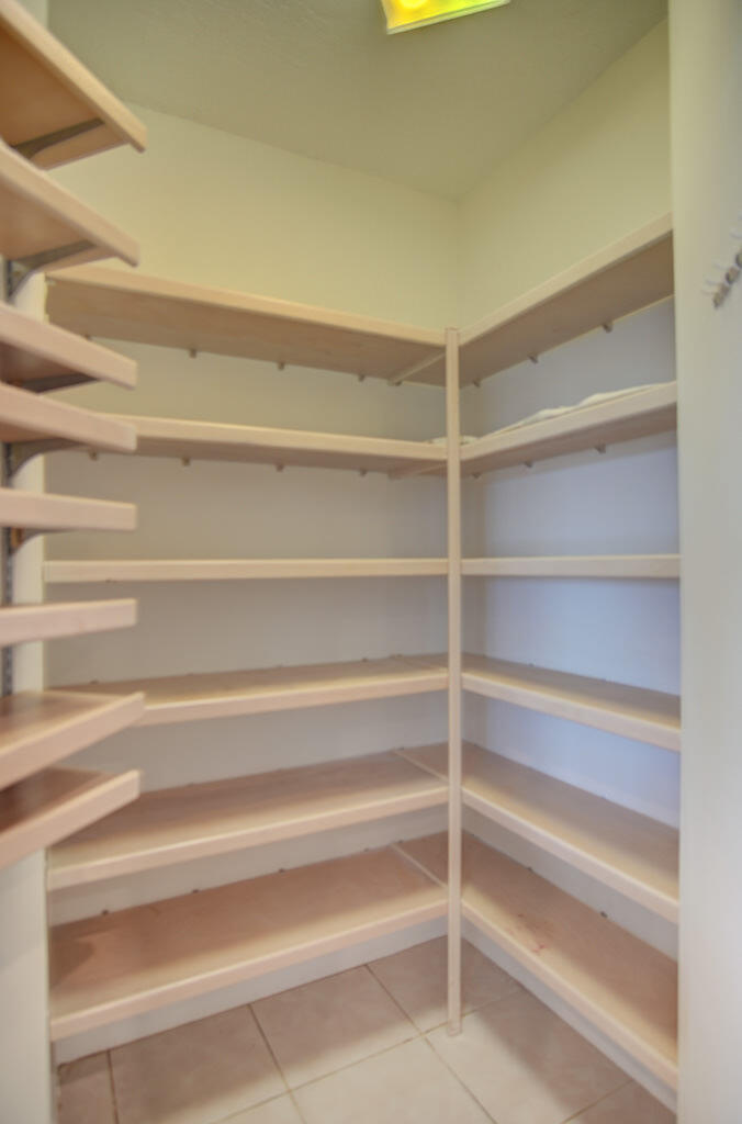 1823 Southwest 17th Street Boca Raton, FL 33486 - Photo 27 of 67 a view of walk in closet with empty racks