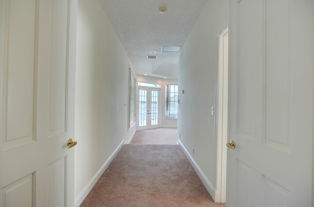 1823 Southwest 17th Street Boca Raton, FL 33486 - Photo 34 of 67 a view of a hallway with wooden floor and a window