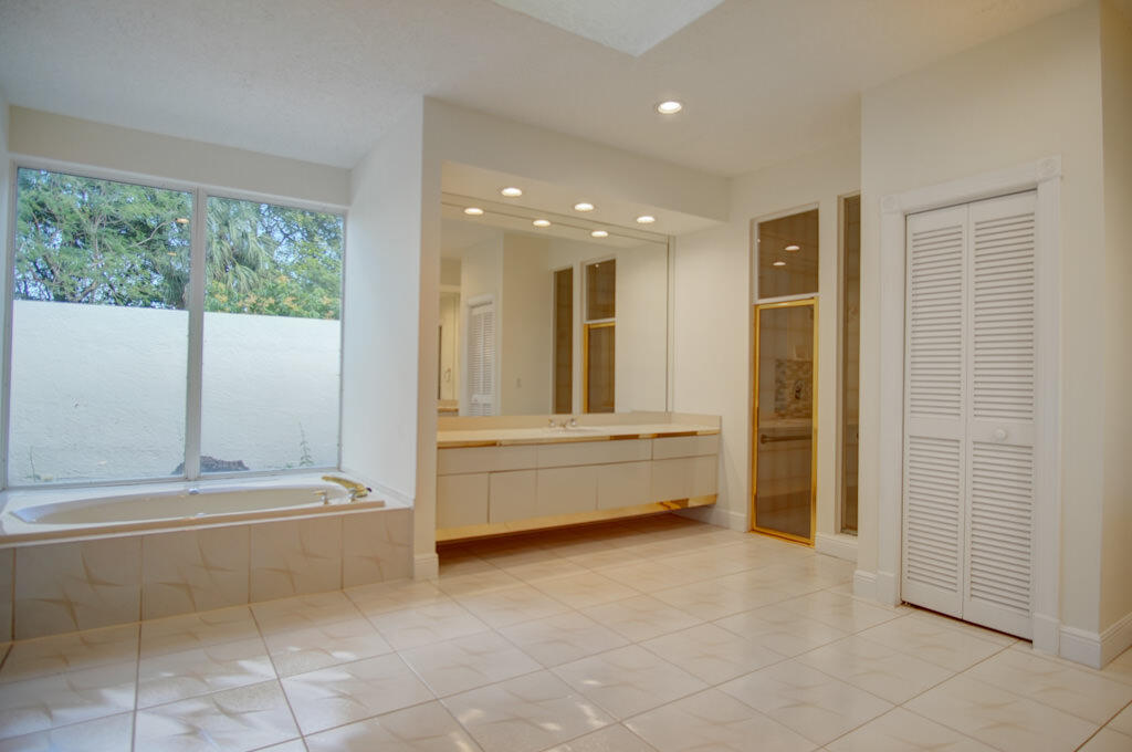 1823 Southwest 17th Street Boca Raton, FL 33486 - Photo 39 of 67 a bathroom with a bathtub and a shower