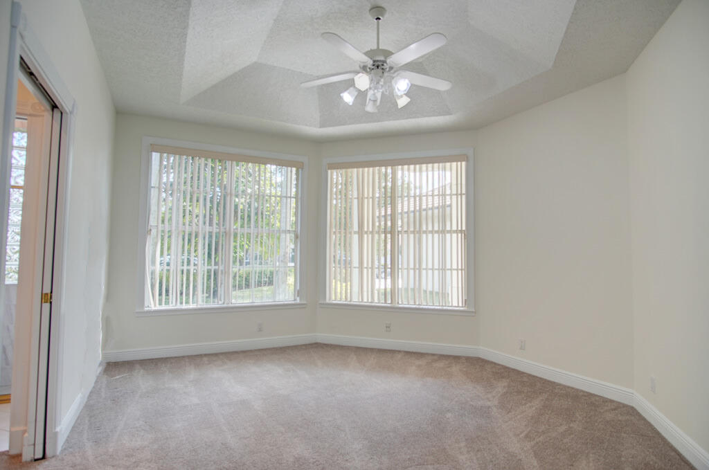 1823 Southwest 17th Street Boca Raton, FL 33486 - Photo 43 of 67 an empty room with chandelier fan and windows