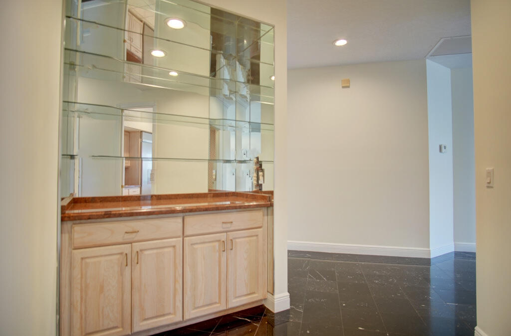 1823 Southwest 17th Street Boca Raton, FL 33486 - Photo 52 of 67 a bathroom with a granite countertop sink and a mirror