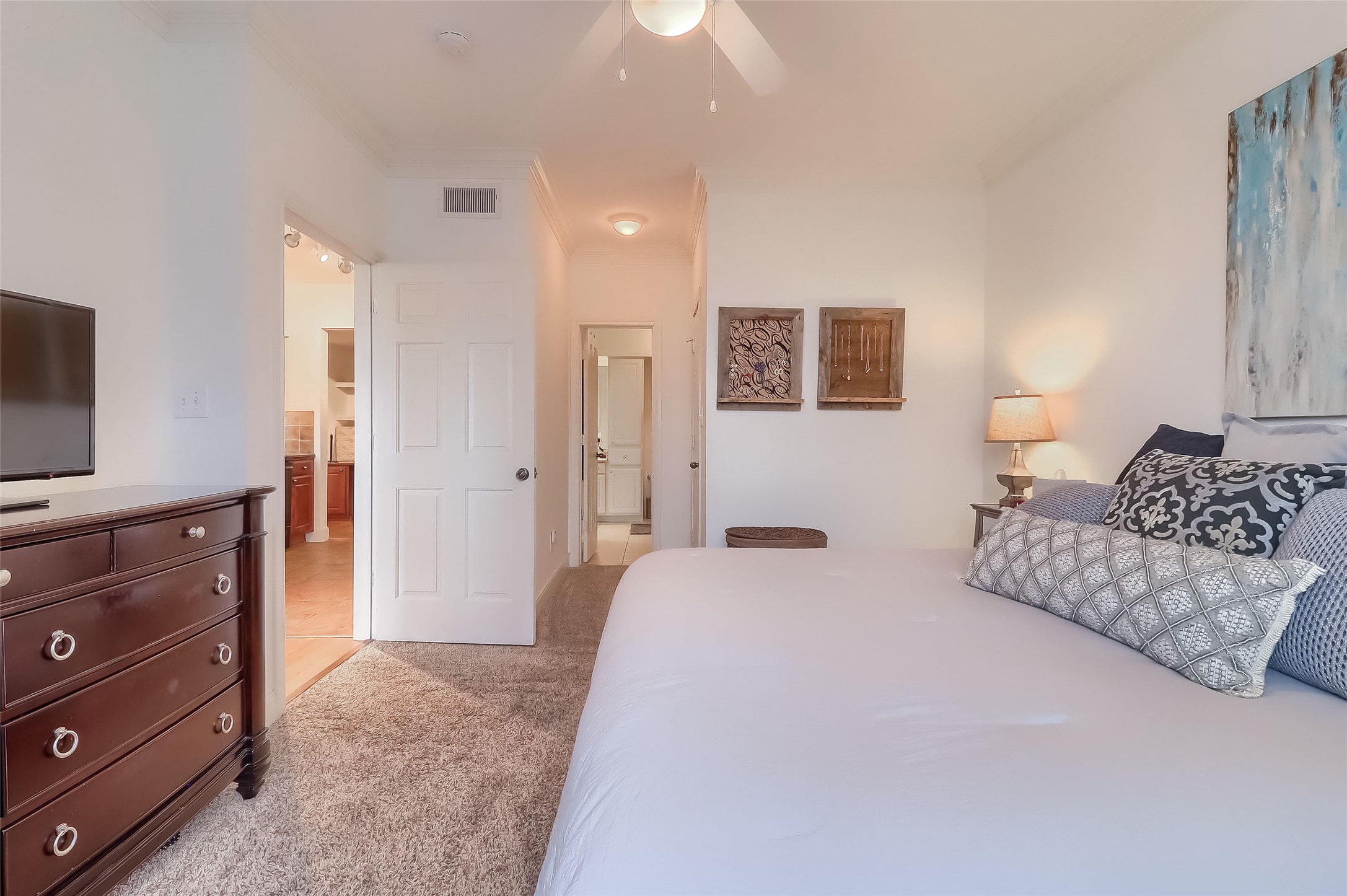 7701 Rialto Boulevard, Unit 1128 Austin, TX 78735 - Photo 14 of 35 a spacious bedroom with a bed and a couch