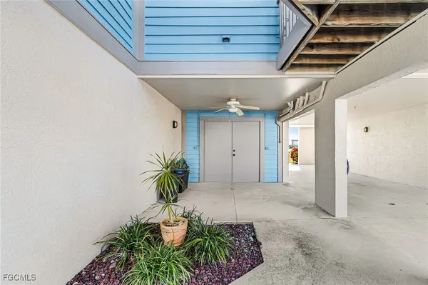 a view of a livingroom with furniture and a window