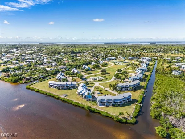 an aerial view of residential houses with outdoor space