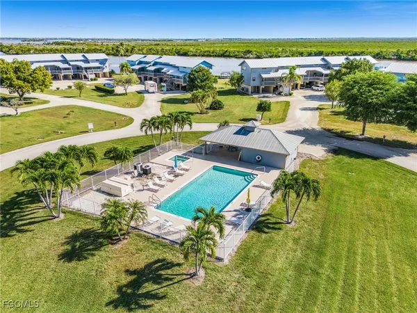 an aerial view of residential houses with outdoor space