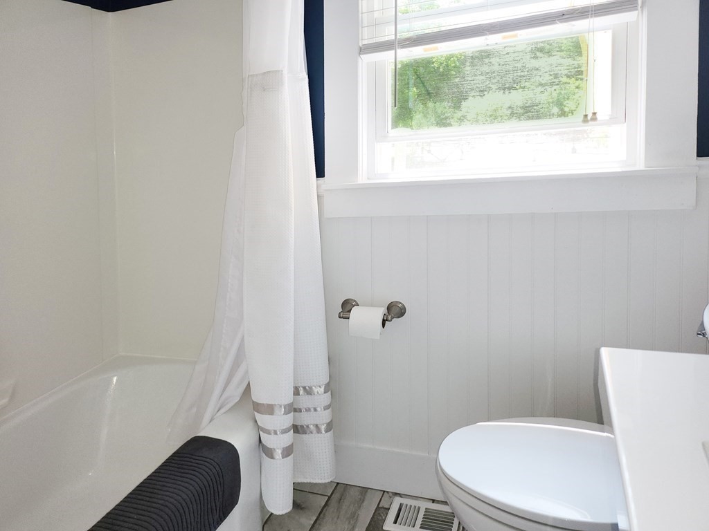 112 Marion Road Rochester, MA 02770 - Photo 16 of 18 a white toilet sitting next to a bath tub