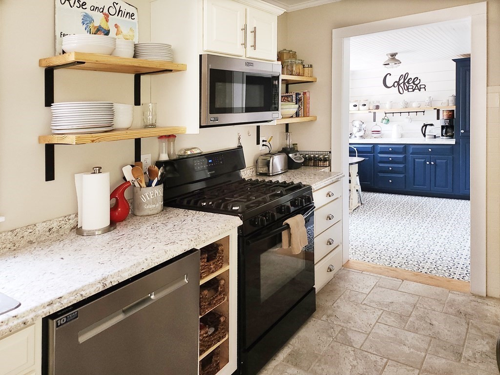 112 Marion Road Rochester, MA 02770 - Photo 6 of 18 a kitchen with stainless steel appliances granite countertop a stove and a sink