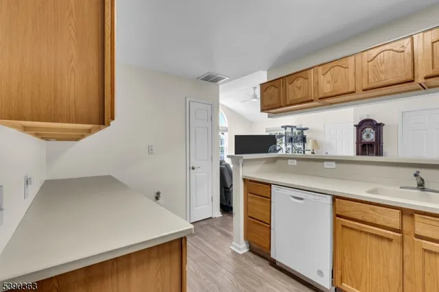 a kitchen with a sink and a refrigerator