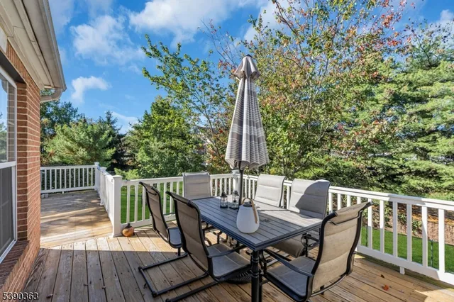 a view of balcony with furniture and wooden deck