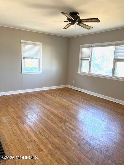 4 Cedar Avenue Waretown, NJ 08758 - Photo 4 of 15 a view of an empty room with wooden floor and a window