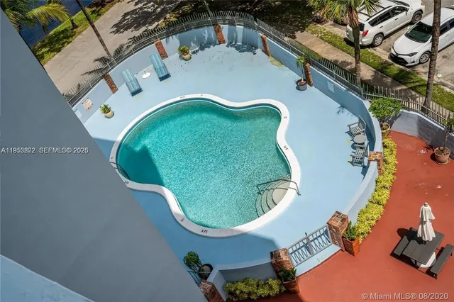 an aerial view of a house with a swimming pool