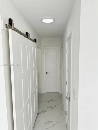a view of a hallway with closet area