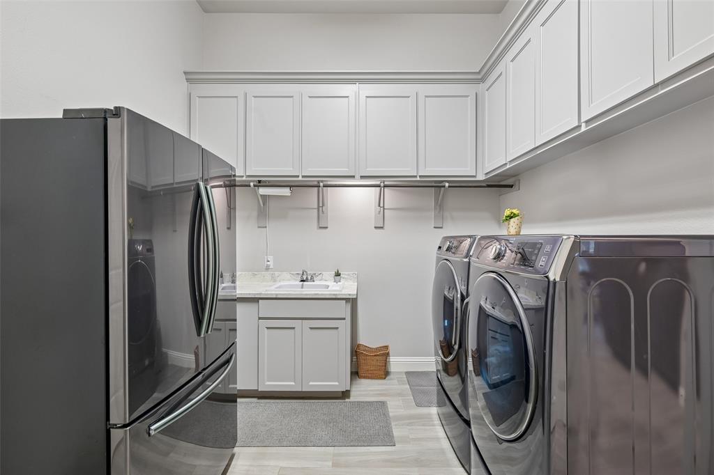 1657 Florence Road Keller, TX 76262 - Photo 23 of 40 a utility room with dryer and washer