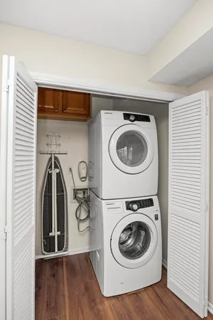 a utility room with sink dryer and washer
