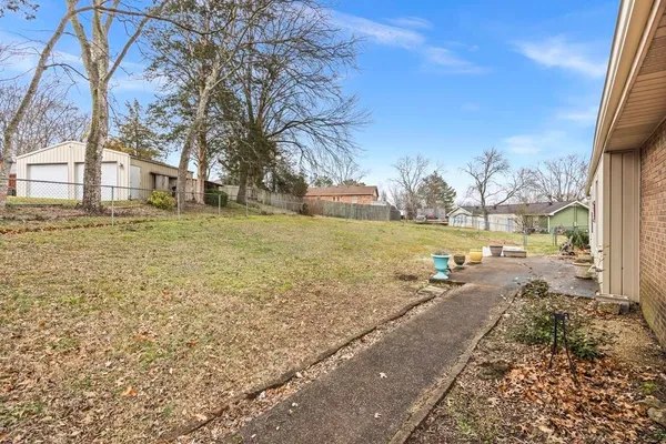 a view of a yard with a house