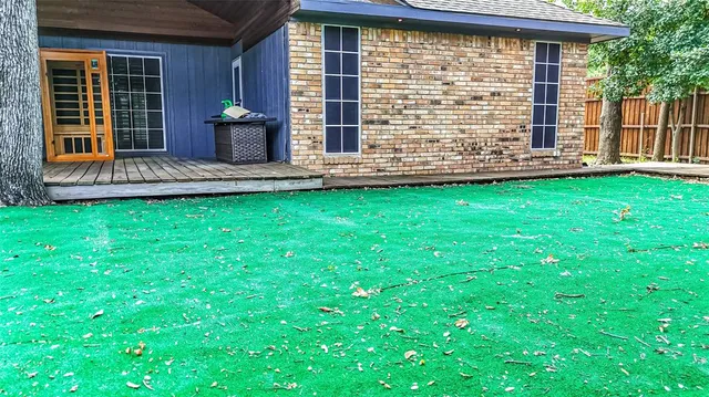 a view of a house with a backyard