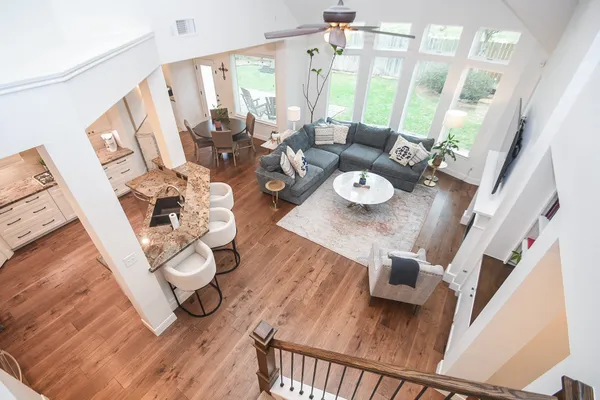 a living room with furniture and wooden floor