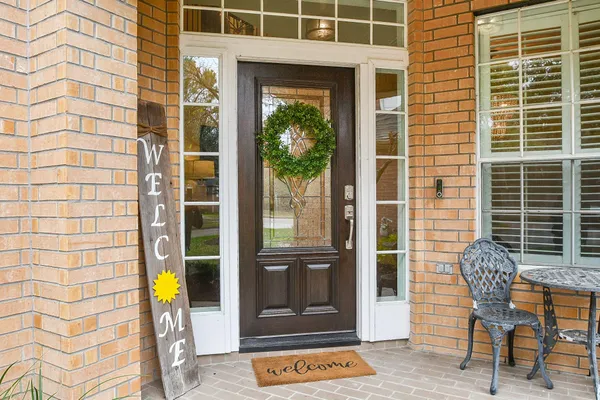 a view of a door with a door and a chair