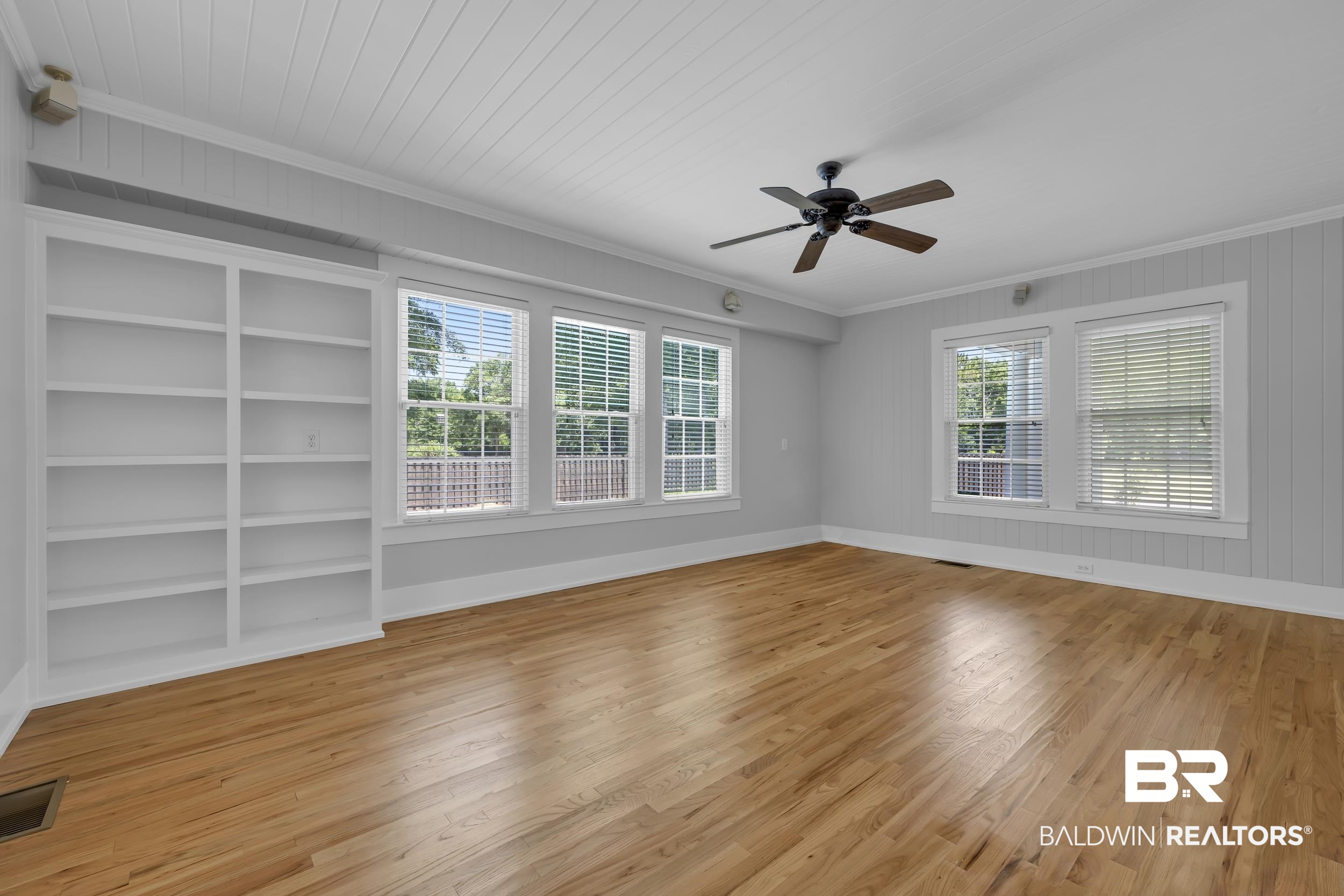 43199 Pine Grove Road Bay Minette, AL 36507 - Photo 32 of 71 Spacious room featuring wood-finish flooring, a white beadboard ceiling, and light gray shiplap walls