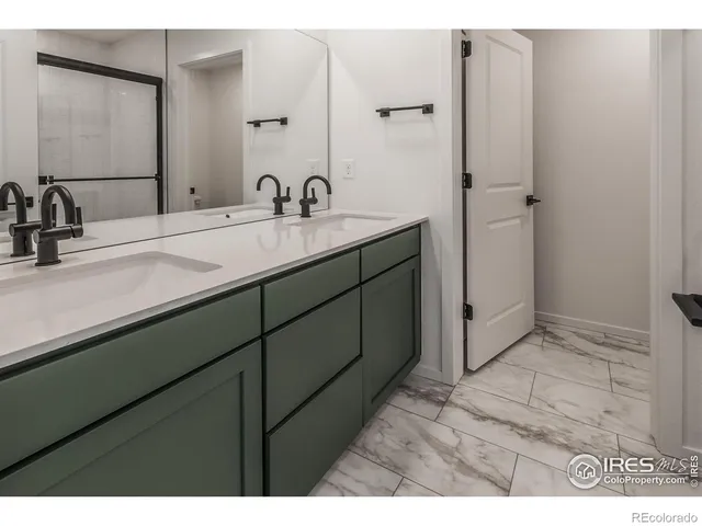 a bathroom with a sink and mirror