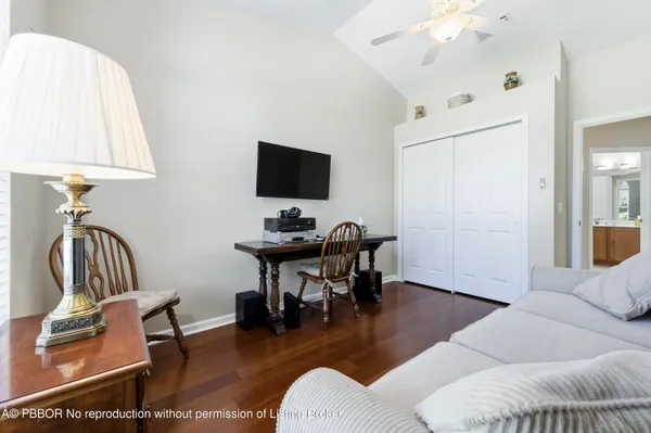 a view of a livingroom with furniture and a flat screen tv