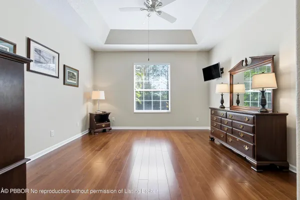 a view of livingroom with hardwood floor and a ceiling fan