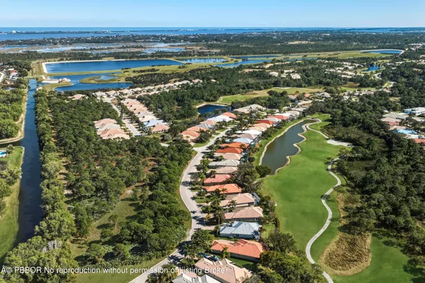 an aerial view of lake residential houses with outdoor space and swimming pool