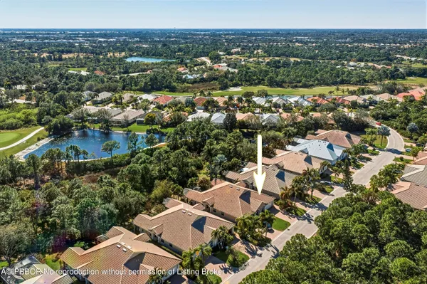 an aerial view of residential houses with city view