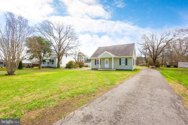 a view of house with garden and entertaining space