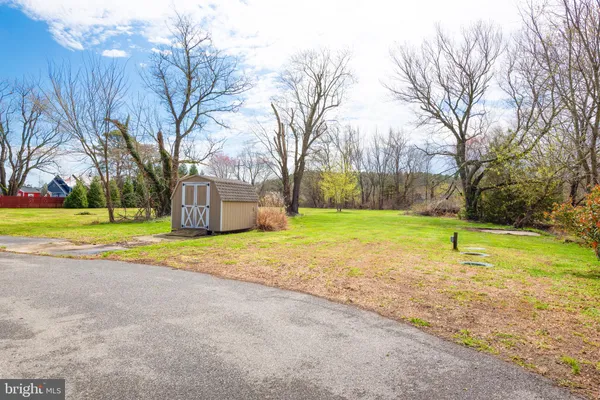 a view of a playground with basketball court