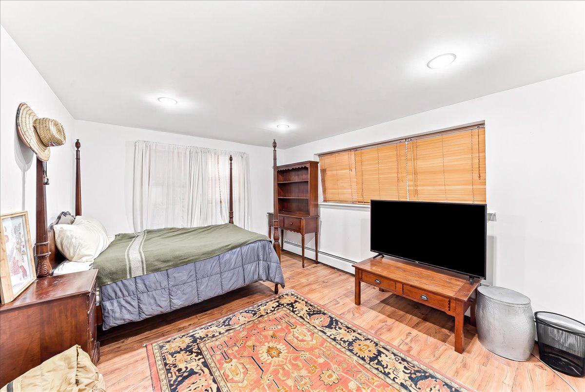 3671 St Peters Road Elverson, PA 19520 - Photo 14 of 37 a bedroom with bed and glass door