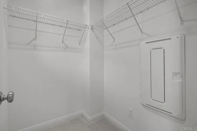 a bathroom with a shower sink vanity and mirror