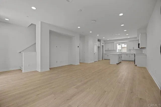 a view of an empty room with a cabinet