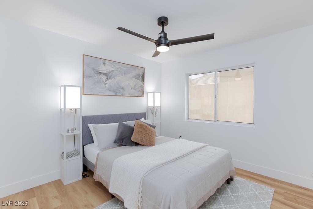 502 Edgefield Ridge Place Henderson, NV 89012 - Photo 23 of 38 Bedroom featuring wood finished floors, baseboards, and a ceiling fan