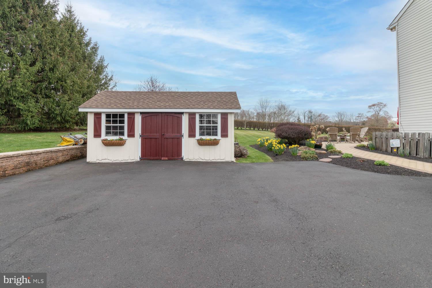 1026 Creamery Road Perkasie, PA 18944 - Photo 11 of 45 a view of a house with a yard and fence