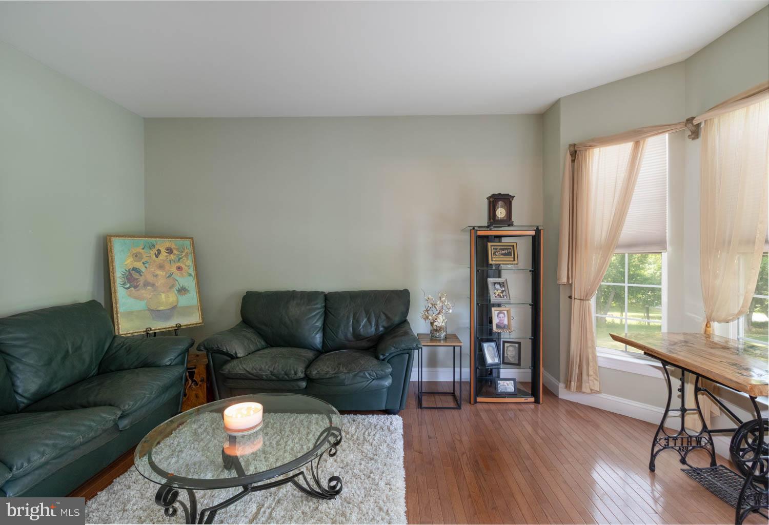 1026 Creamery Road Perkasie, PA 18944 - Photo 14 of 45 a living room with furniture and a wooden floor