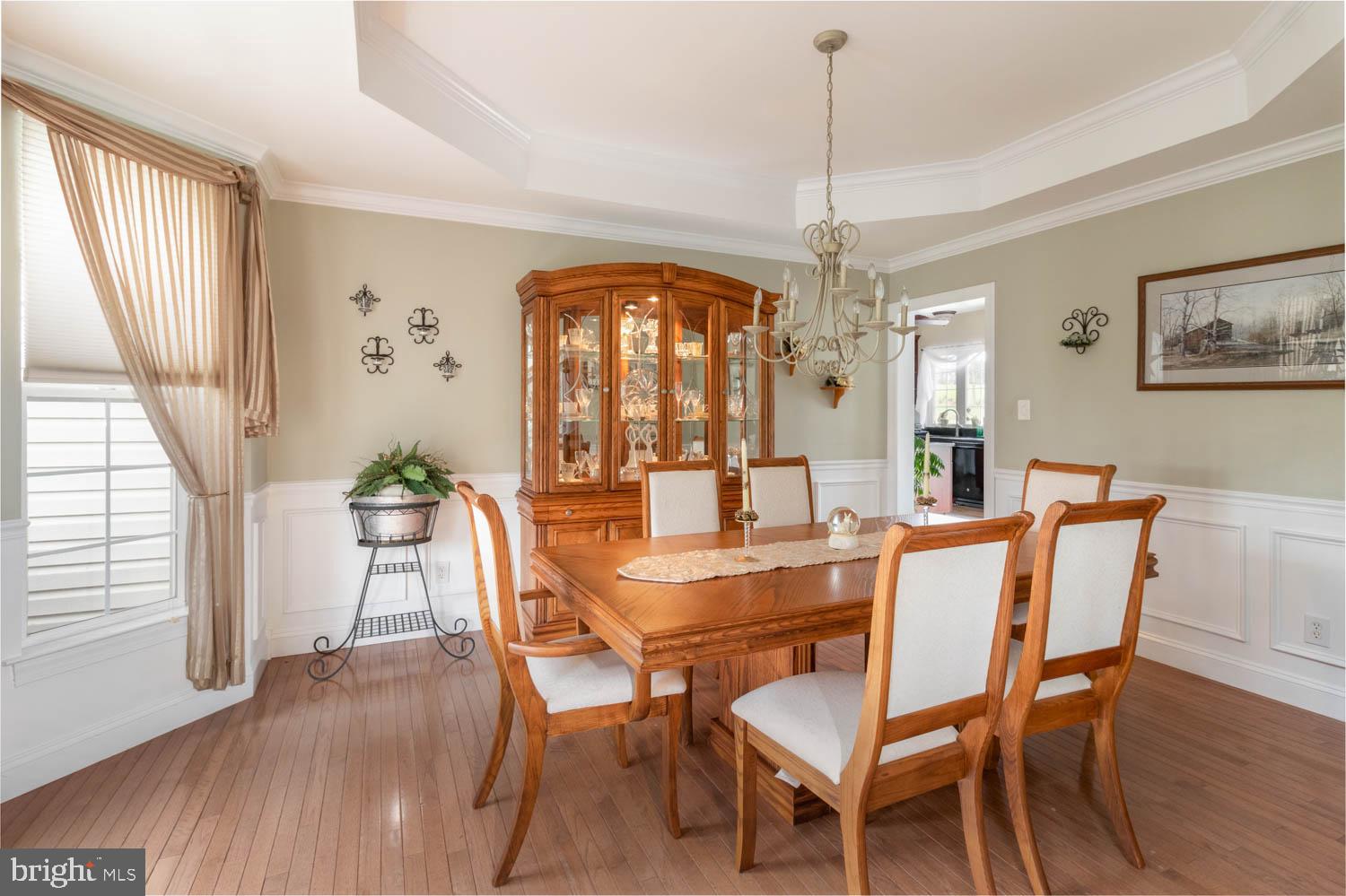 1026 Creamery Road Perkasie, PA 18944 - Photo 15 of 45 a view of a dining room with furniture window and wooden floor
