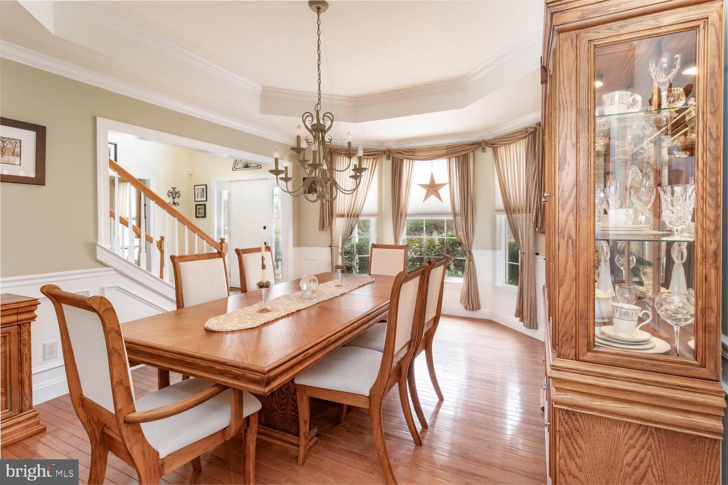 1026 Creamery Road Perkasie, PA 18944 - Photo 16 of 45 a view of a dining room with furniture window and wooden floor