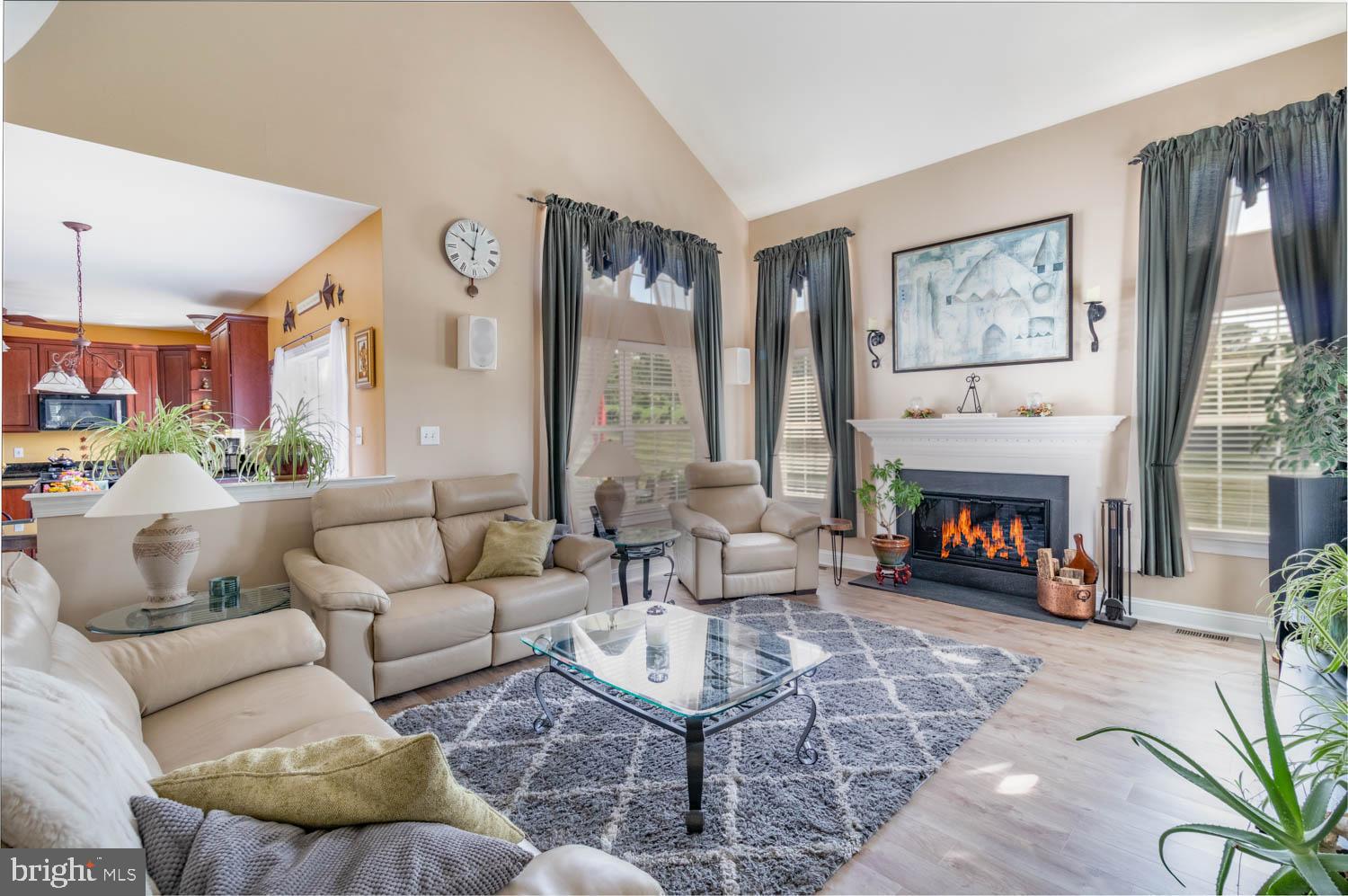 1026 Creamery Road Perkasie, PA 18944 - Photo 19 of 45 a living room with furniture large window and a fireplace