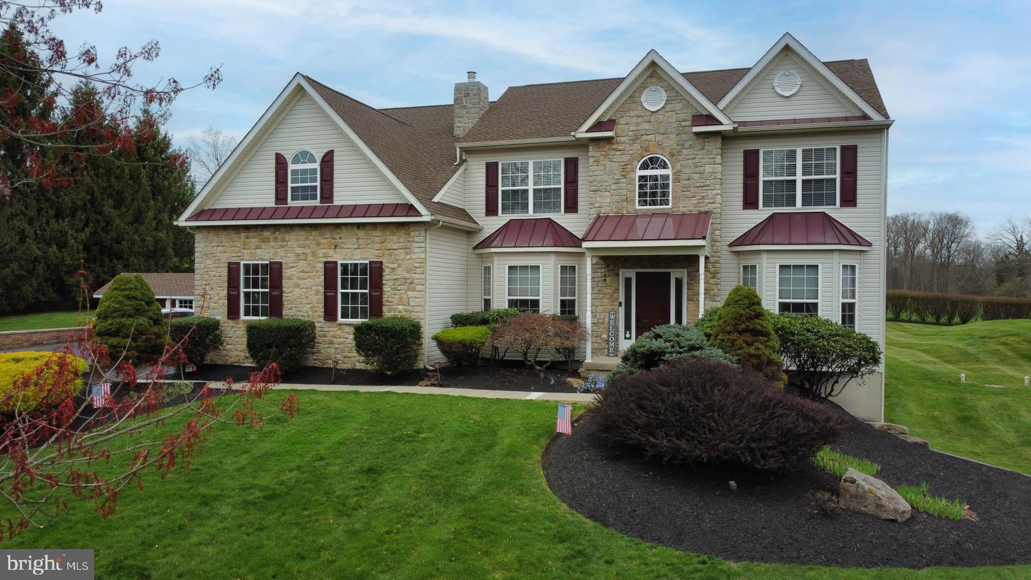 1026 Creamery Road Perkasie, PA 18944 - Photo 2 of 45 a front view of a house with a yard and potted plants