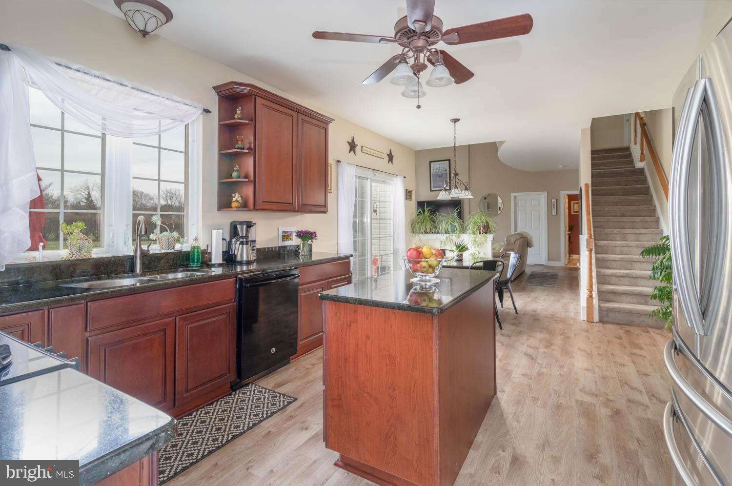 1026 Creamery Road Perkasie, PA 18944 - Photo 23 of 45 a kitchen with stainless steel appliances granite countertop a sink stove and refrigerator