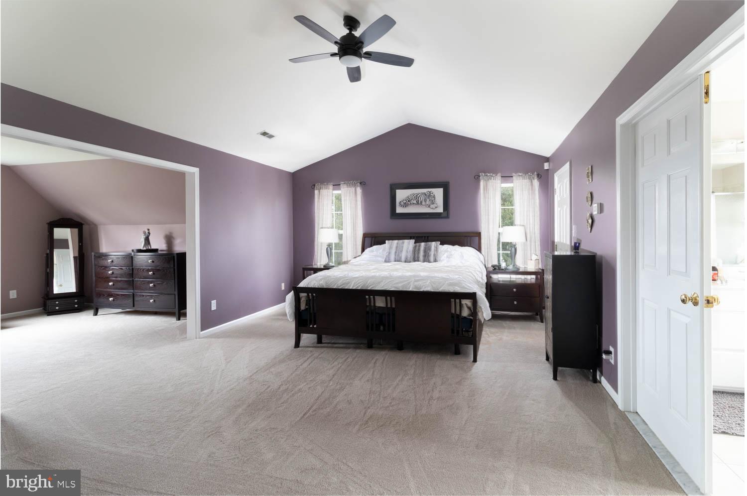 1026 Creamery Road Perkasie, PA 18944 - Photo 24 of 45 a bedroom with a bed and a chandelier