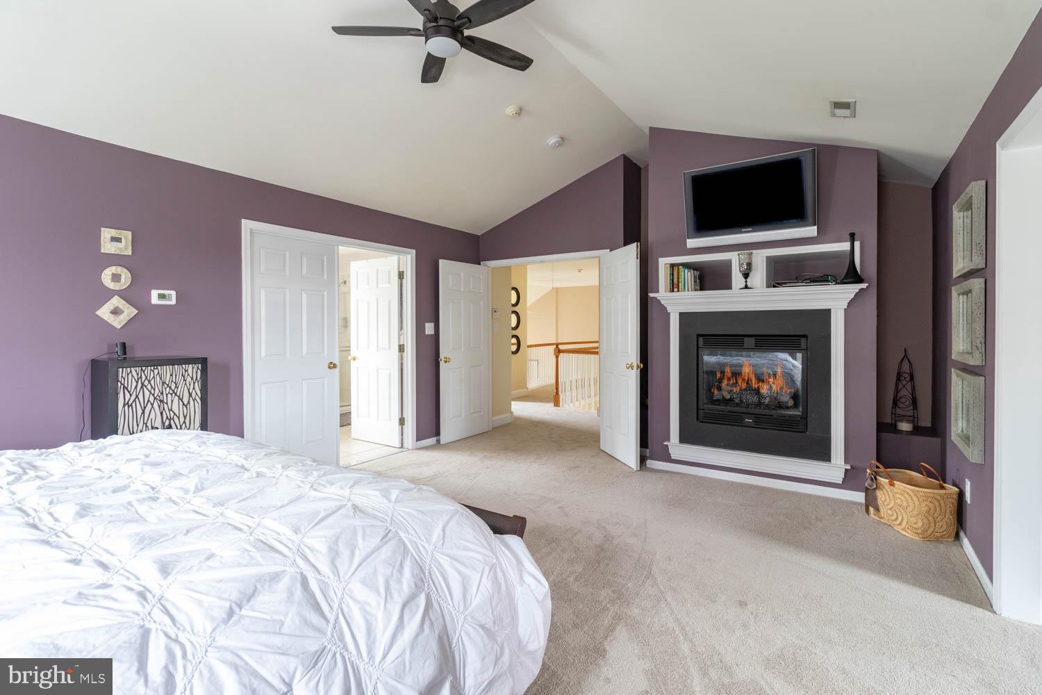 1026 Creamery Road Perkasie, PA 18944 - Photo 25 of 45 a bedroom with a bed and a fireplace