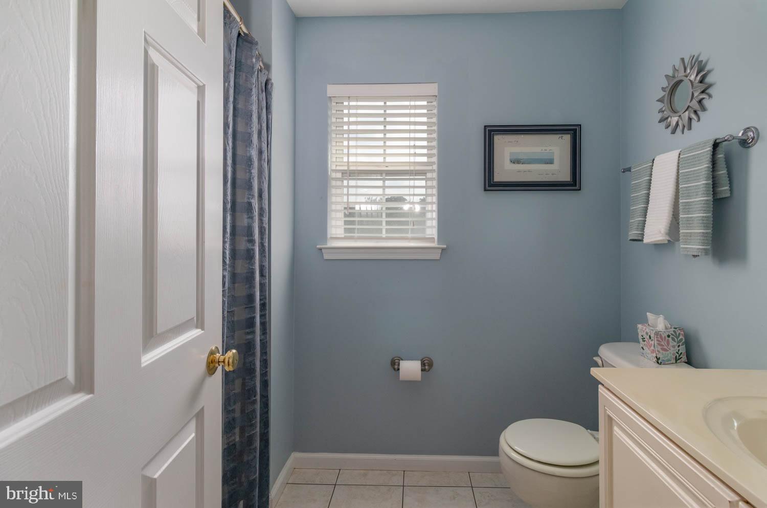 1026 Creamery Road Perkasie, PA 18944 - Photo 27 of 45 a white toilet sitting next to a bathroom sink
