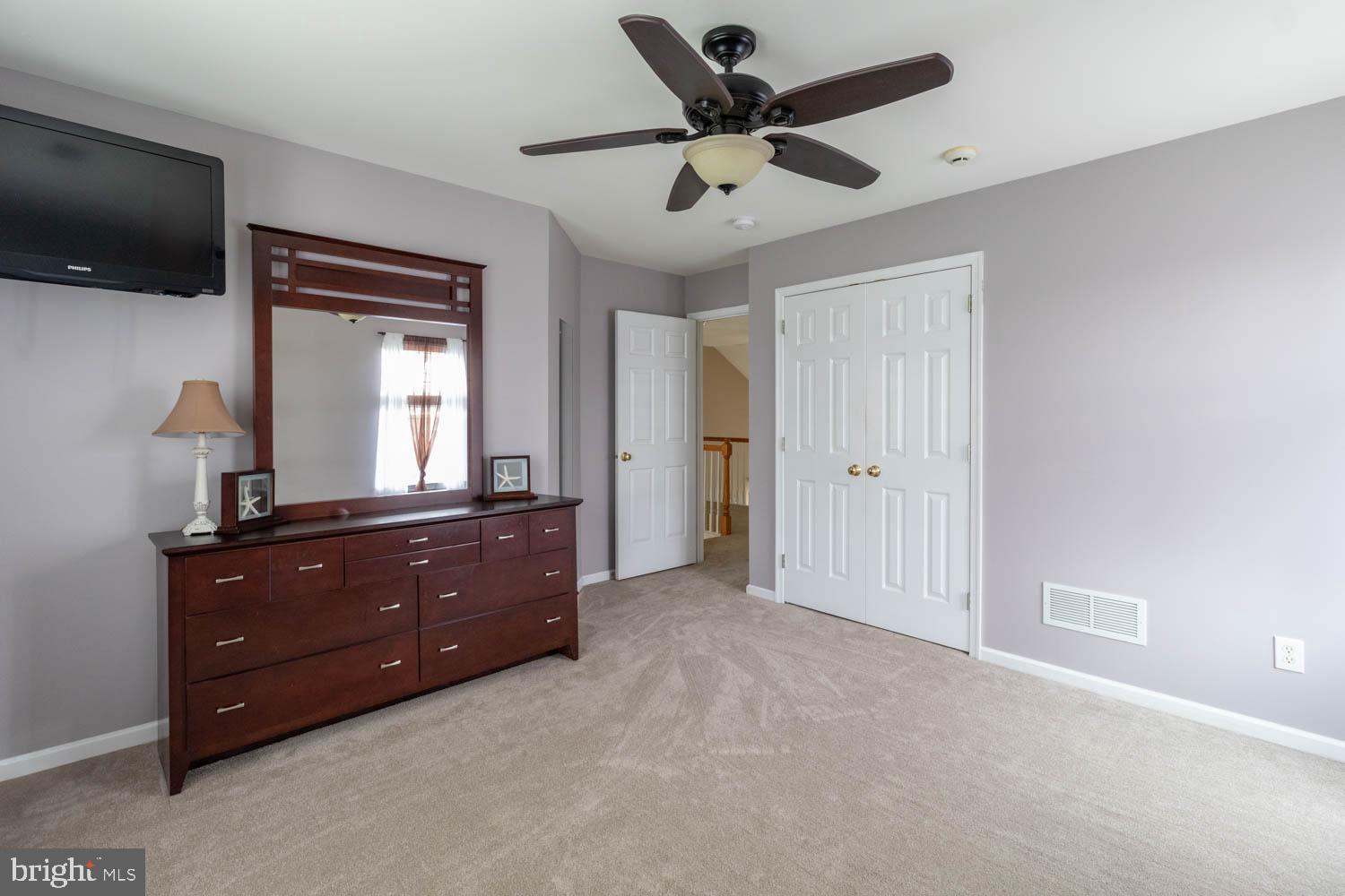 1026 Creamery Road Perkasie, PA 18944 - Photo 29 of 45 a room with a bed and a flat screen tv