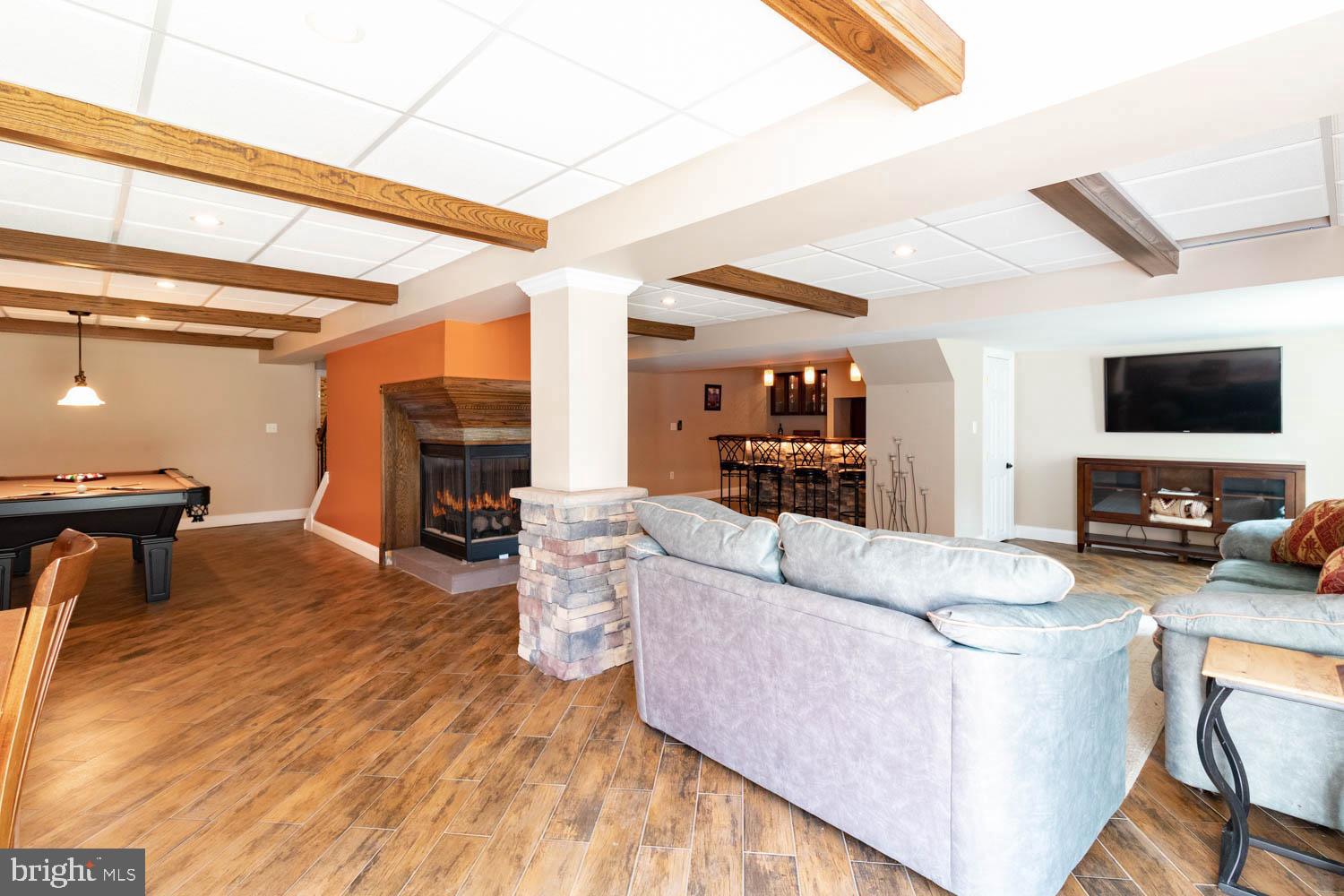 1026 Creamery Road Perkasie, PA 18944 - Photo 34 of 45 a living room with furniture and a flat screen tv