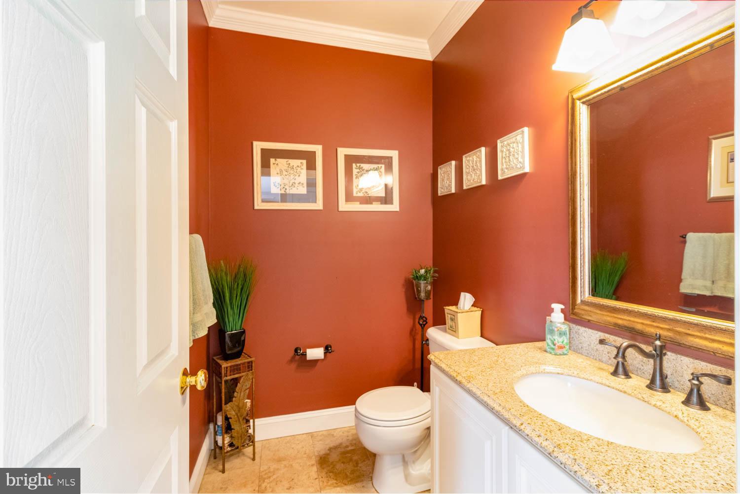 1026 Creamery Road Perkasie, PA 18944 - Photo 37 of 45 a bathroom with a granite countertop toilet and a sink