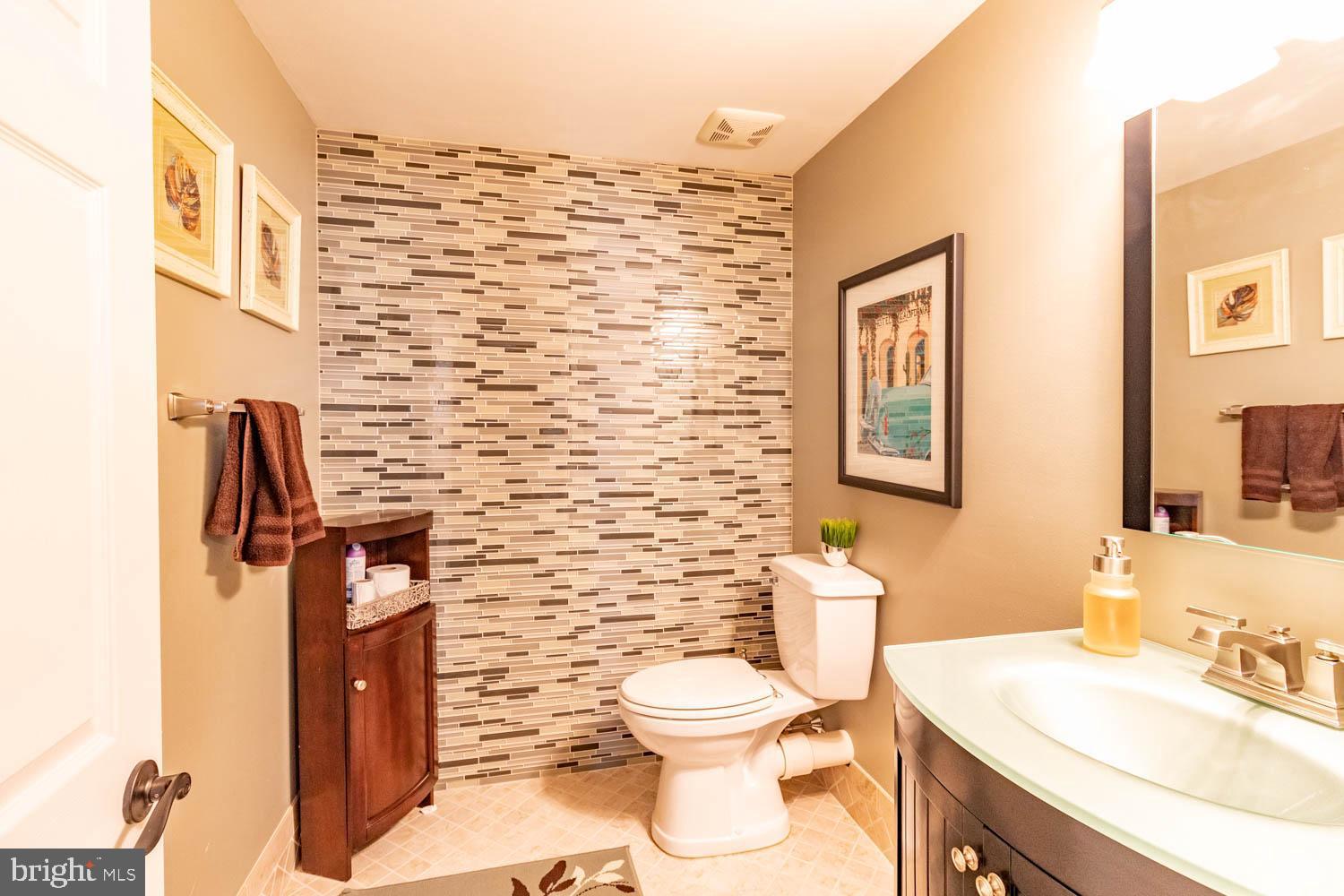 1026 Creamery Road Perkasie, PA 18944 - Photo 38 of 45 a bathroom with a toilet sink and mirror