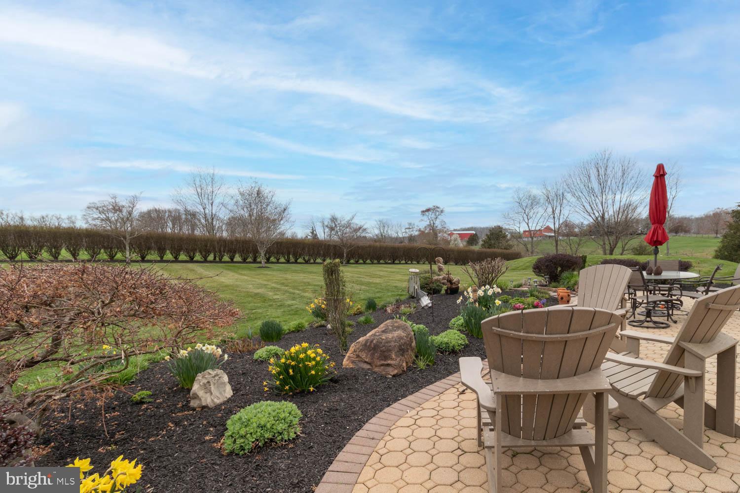 1026 Creamery Road Perkasie, PA 18944 - Photo 4 of 45 a view of a lake with couches chairs and a potted plant