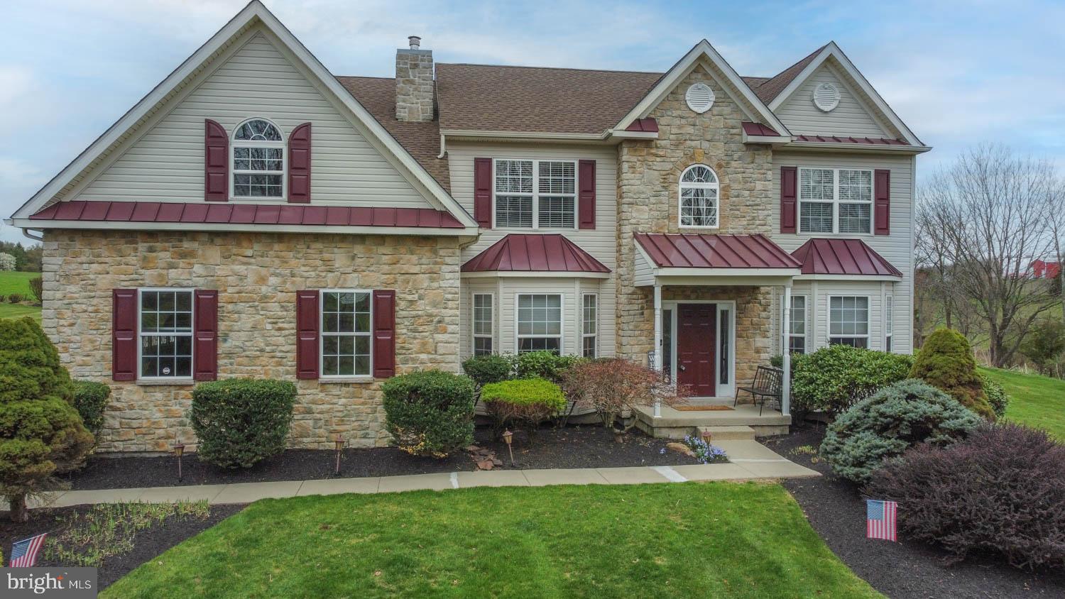 1026 Creamery Road Perkasie, PA 18944 - Photo 41 of 45 a front view of a house with a garden and plants
